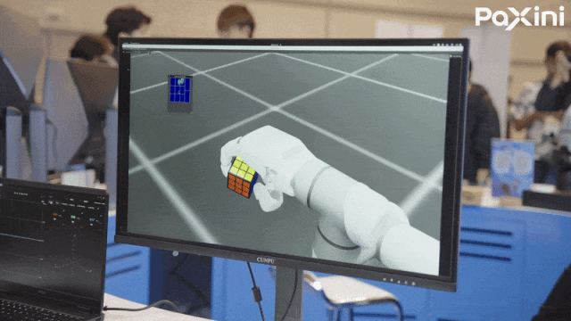 Engineers testing a robotic hand in a laboratory